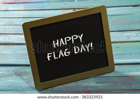 Flag Day chalk sign on blue wood background