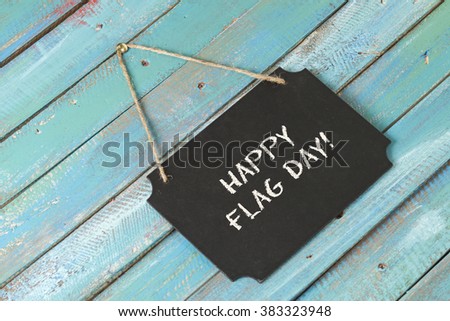 Flag Day chalk sign on blue wood background