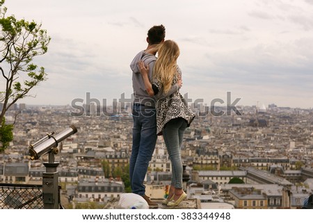 Woman and man kissing and embracing on the Paris streets