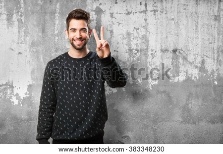 man doing a number two with fingers