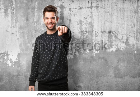 young man pointing front
