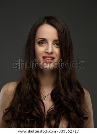 Portrait of emotion woman with long brown hair.