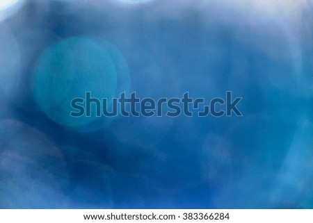blue blur background with white spots