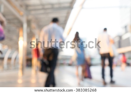 Blur abstract  background of business people walking in the landmark business center / silhouettes motion style