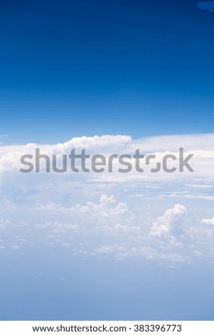 Big white cloud and blue sky background,view from airplane