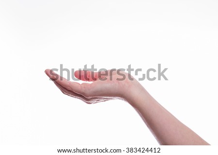 Woman hand making cupping gesture against a white background.