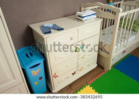 The modern children's nursery with a dresser