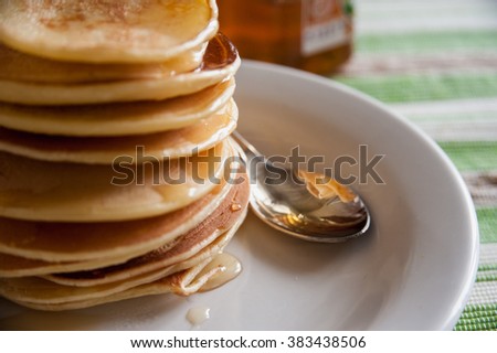 fragrant pancakes for breakfast with a spoonful of honey flavored