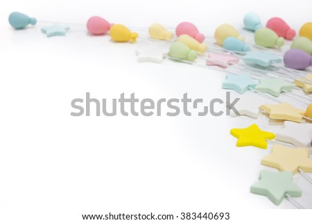 pastel color of stars and cute balloons as part of background with empty space for additional text or presentation - isolated with white background