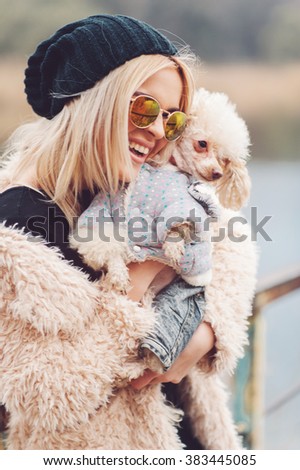 young caucasian cute girl portrait with dog outdoor in park walking happy and smile all the way 