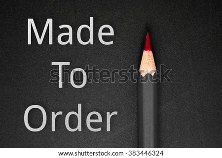 Text Made to order and pencil on black background / business concept