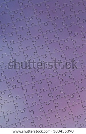 A macro shot of a puzzle. Image has a bit of a vintage twist in the tones.