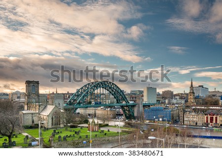 Newcastle Skyline / Newcastle skyline showing the iconic Tyne Bridge. St Mary's church to the left and All Saints Church on the right Royalty-Free Stock Photo #383480671