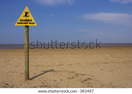 Danger sinking mud sign, sand point beach England uk