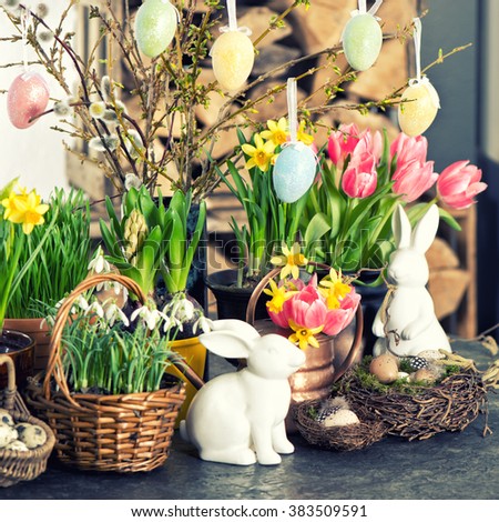 Easter decoration with flowers and eggs. Vintage style toned picture. Selective focus
