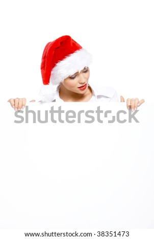 Woman in santa hat with empty white board