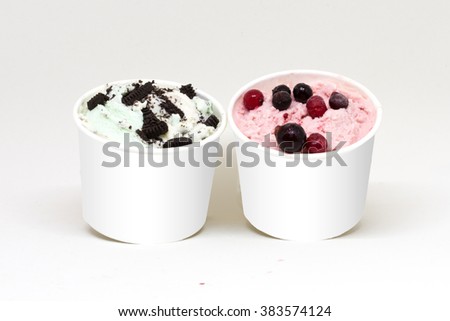 two cup chocolate cookie on mint flavor icecream and mixed berry on strawberry flavor icecream on white cups with isolate white background Royalty-Free Stock Photo #383574124