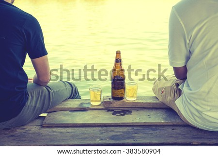 Two best friends drinking beer Royalty-Free Stock Photo #383580904