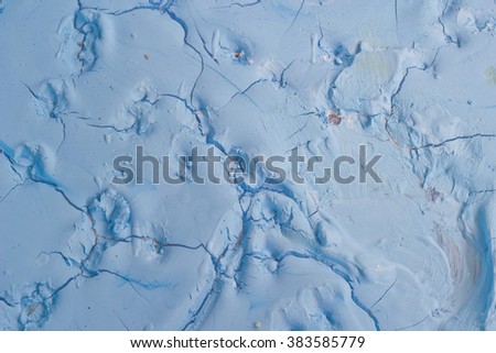 Dry blue oil paint cracks and crevices texture for background 