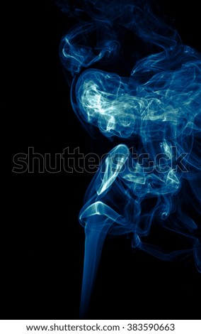 Blue smoke isolated on dark background
