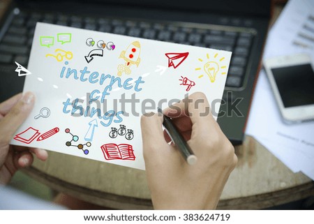 hand drawing INTERNET OF THINGS concept on white notebook , business concept , business idea