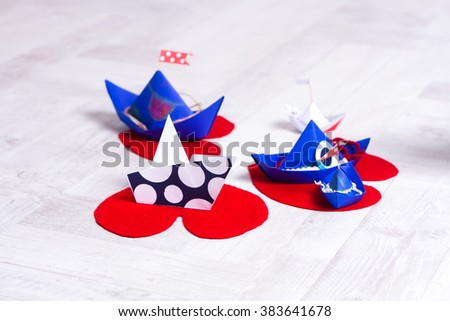 Ã�Â¡olorful paper boats on the wooden floor