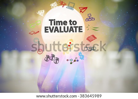holding light bulb with TIME TO EVALUATE text ,business concept ,business idea