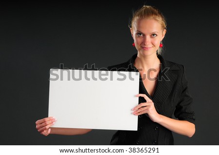  A pretty business woman holding a blank sign