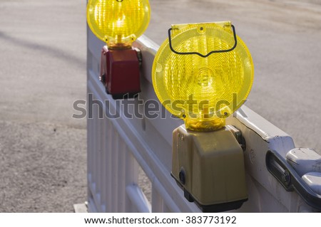 Signal lights on the fence.