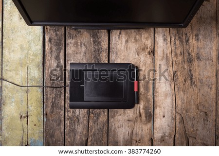 Photographer or designer freelancer remote workplace at wooden desk. Top view image 