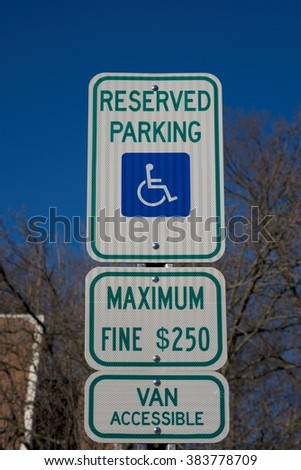 RESERVED PARKING SING FOR HANDICAPPED WITH $ 250 FINE 
