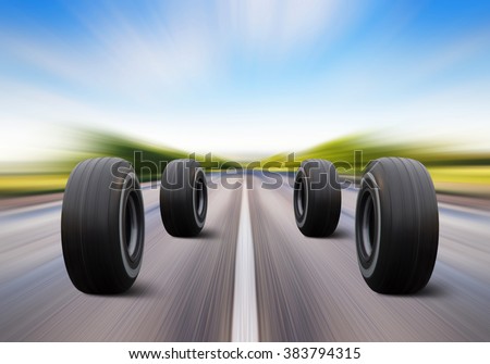 four automobile wheels rush on the road with high speed Royalty-Free Stock Photo #383794315