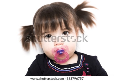 A Portrait of a 2 year old girl isolated on white background