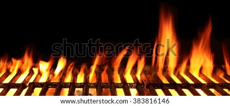 Empty Barbecue Flaming Charcoal Grill With Bright Flames Of Fire Isolated On The Black Background, Close Up, Copy Space, Front View.