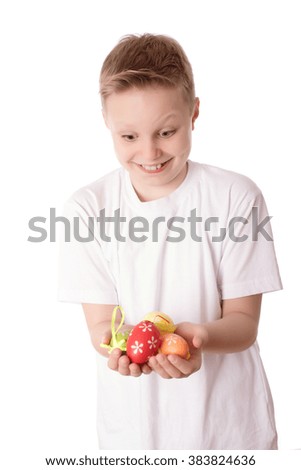 Young boy with his easter eggs over the white background