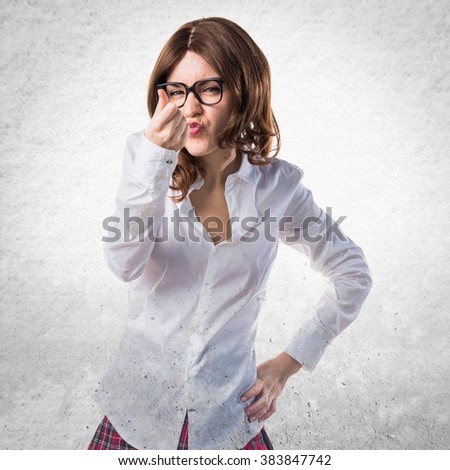 Pretty young girl doing a money gesture