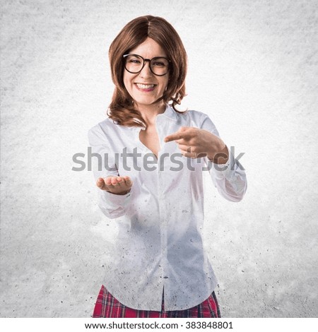 Student girl holding something