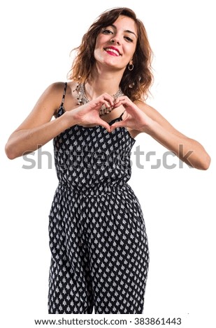 Pretty girl making a heart with her hands