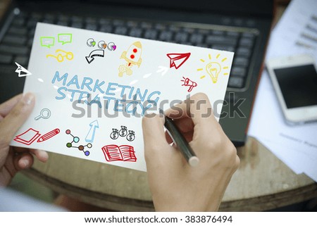 hand drawing MARKETING STRATEGY concept on white notebook , business concept , business idea