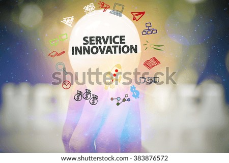 holding light bulb with SERVICE INNOVATION text ,business concept ,business idea