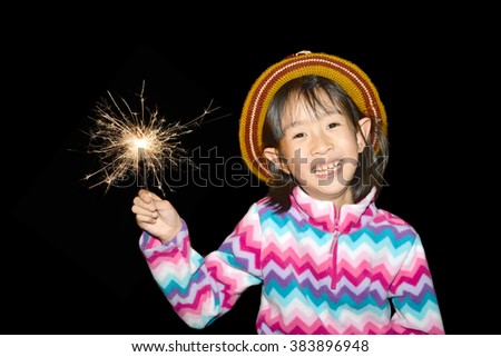 asian girl playing sparklers