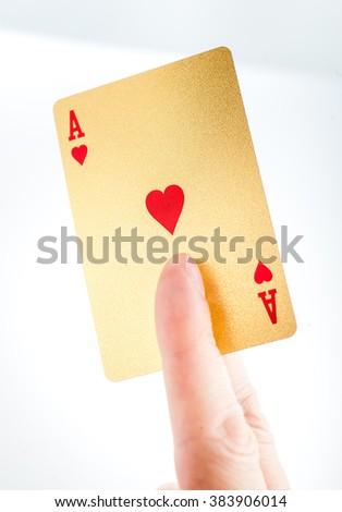 Golden ace in a hand