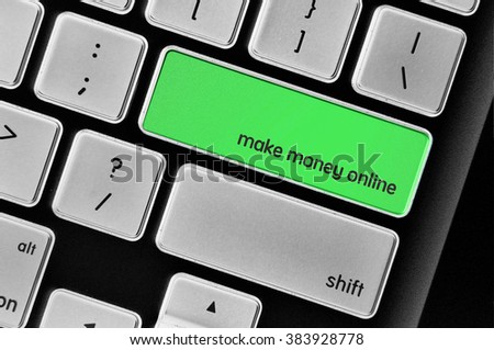 The computer keyboard button written word make money online .
