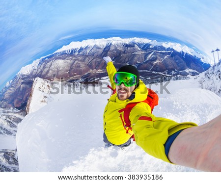 Taking selfie standing on top of the mountain