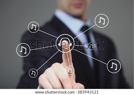 Businessman pressing play music button. headphones and notes