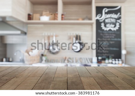 Wood table top with blur kitchen background , empty wooden table for product display Royalty-Free Stock Photo #383981176