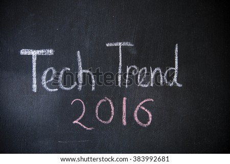 Technology trend concept written on blackboard. Words are written with white color chalk. This photo can use as educational background. 