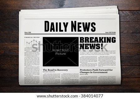 Daily Newspaper with wooden background. Royalty-Free Stock Photo #384014077
