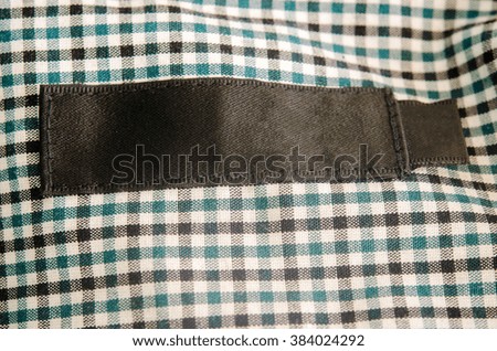 Cloth label tags on the inside of the shirt