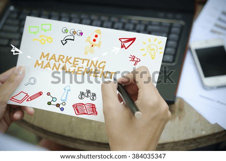 hand drawing MARKETING MANAGEMENT concept on white notebook , business concept , business idea , strategy concept